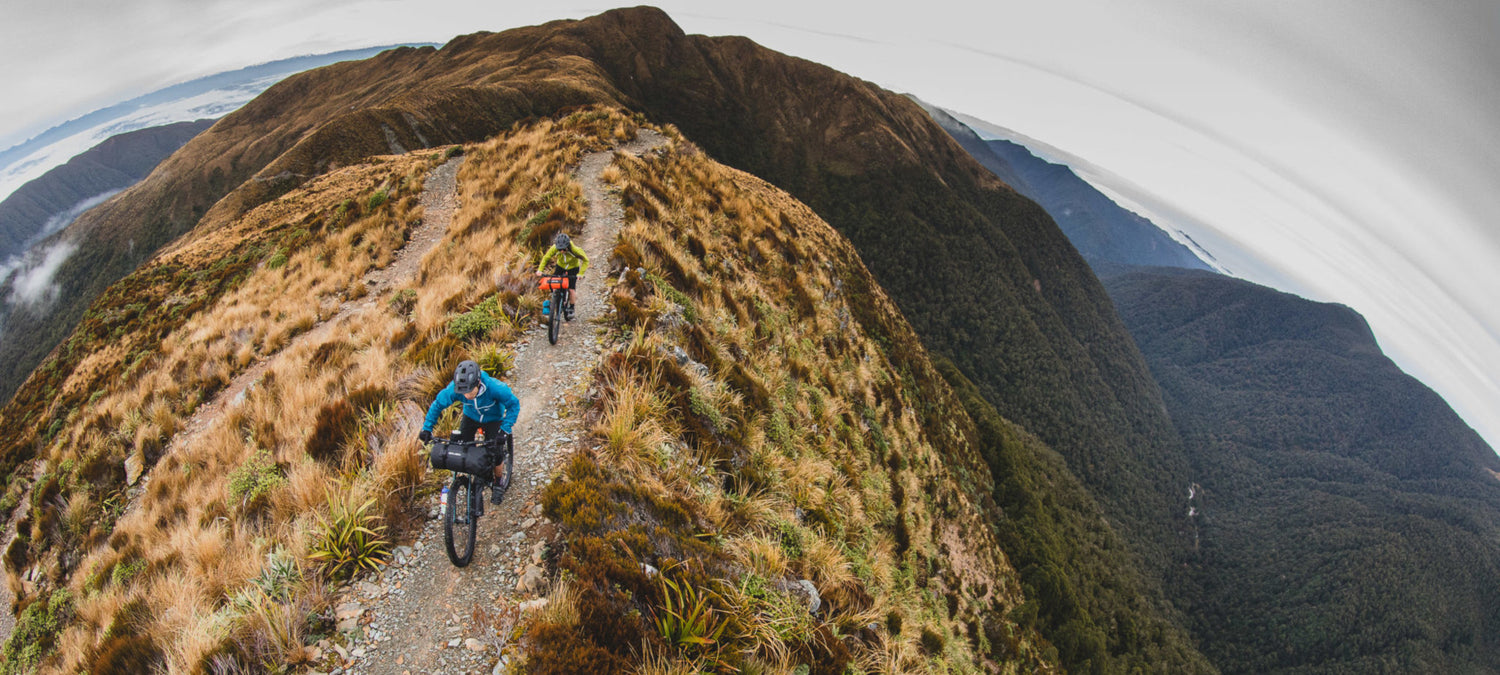 Two riders on Kona Unit X's traversing the Paparoa Track Escarpment