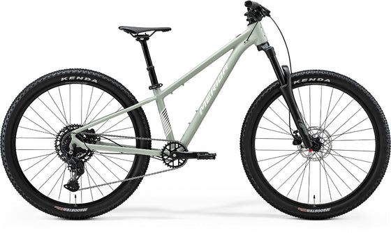 White mountain bike with black components on a white background